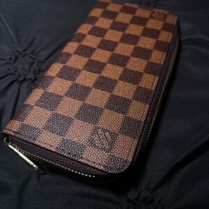 Louis Vuitton signature print zip wallet